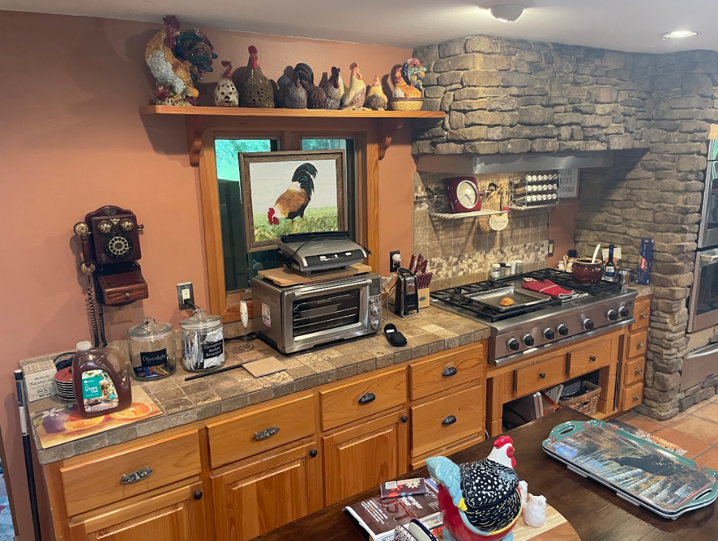 A kitchen with a large island and wooden cabinets.