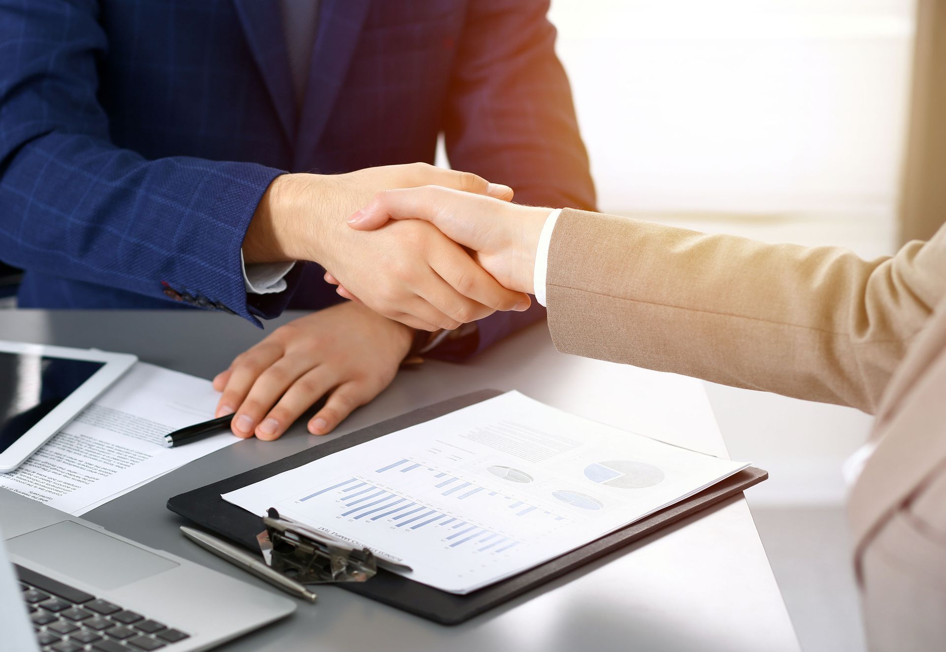 Business professionals shaking hands, finalizing a deal with Robert Taylor Companies, insurance services | Elyria, OH