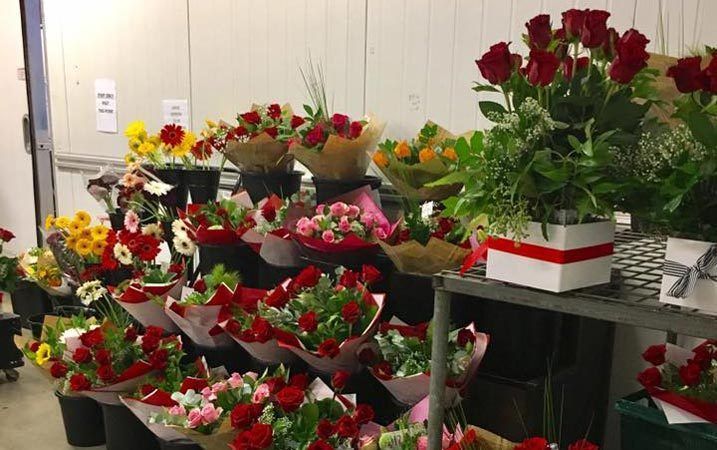 A Bunch of Flowers Are Sitting on a Table in a Room — Suncoast Flowers in Birtinya, QLD
