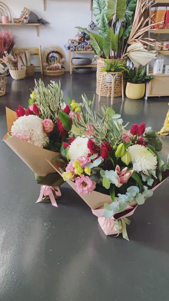 Two Bouquets of Flowers Are Sitting on a Table in a Room — Suncoast Flowers in Birtinya, QLD