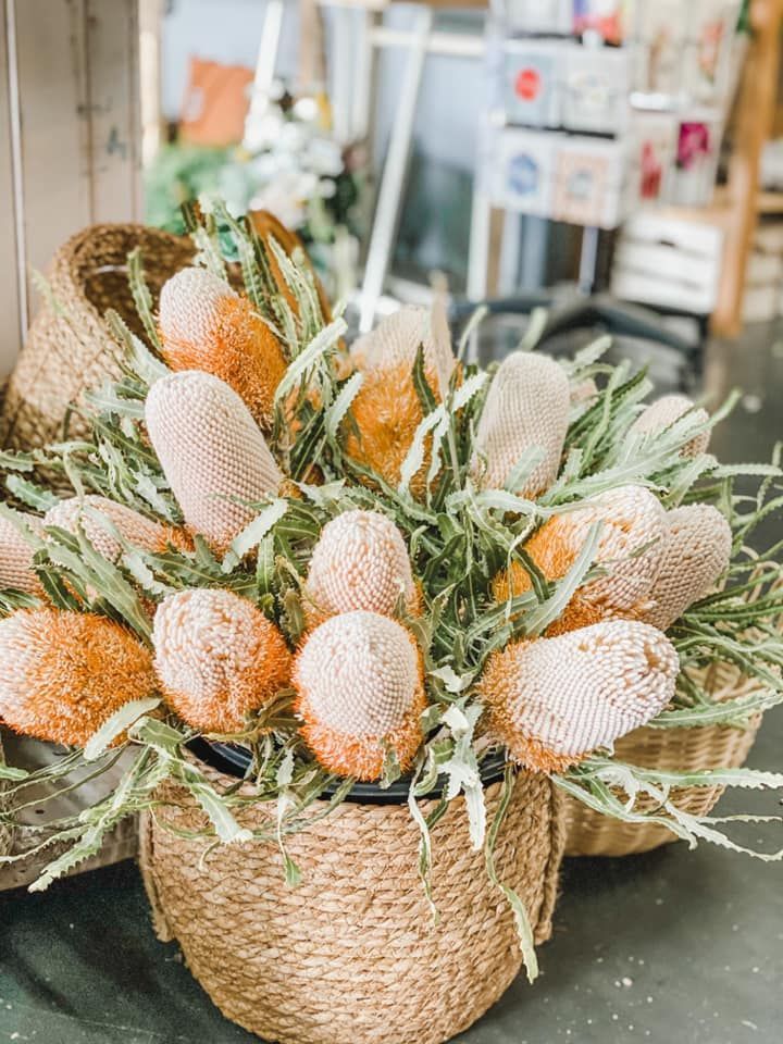 A Bunch of Flowers Are in a Basket on a Table — Suncoast Flowers in Birtinya, QLD