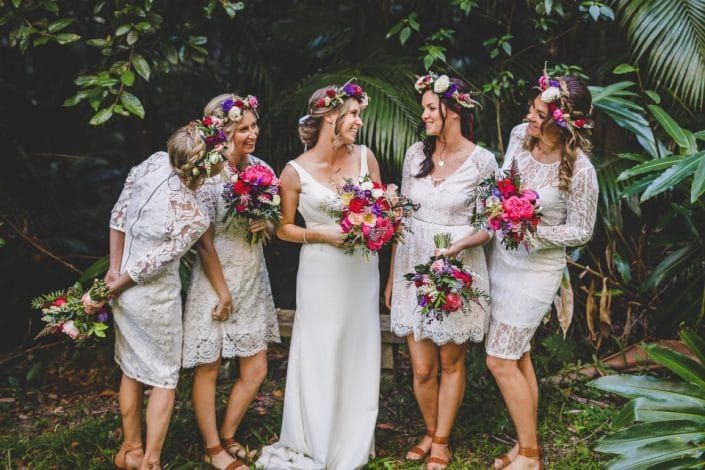A Bride and Her Bridesmaids Are Posing for a Picture — Suncoast Flowers in Birtinya, QLD