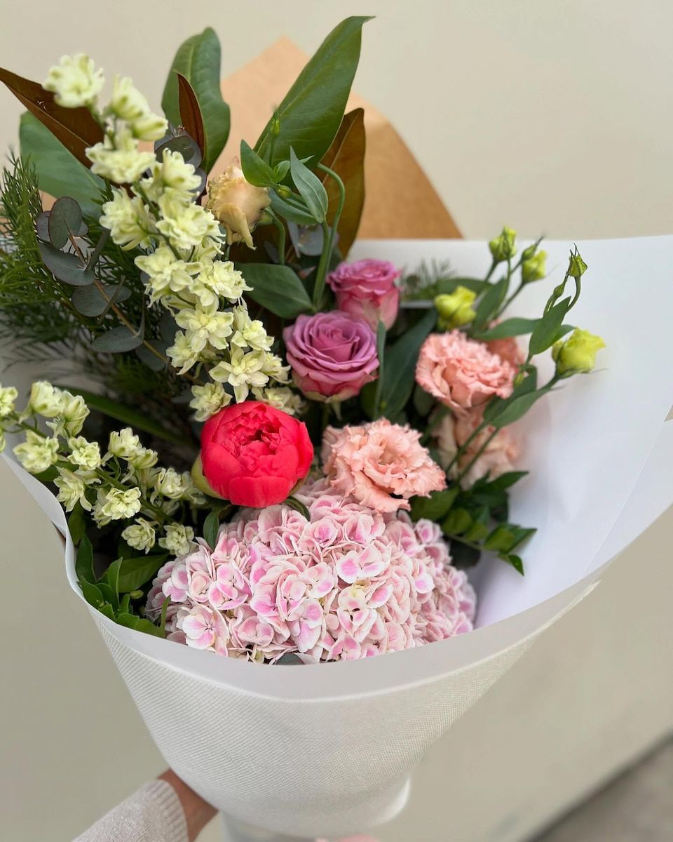 A Person is Holding a Bouquet of Flowers — Suncoast Flowers in Maroochydore, QLD