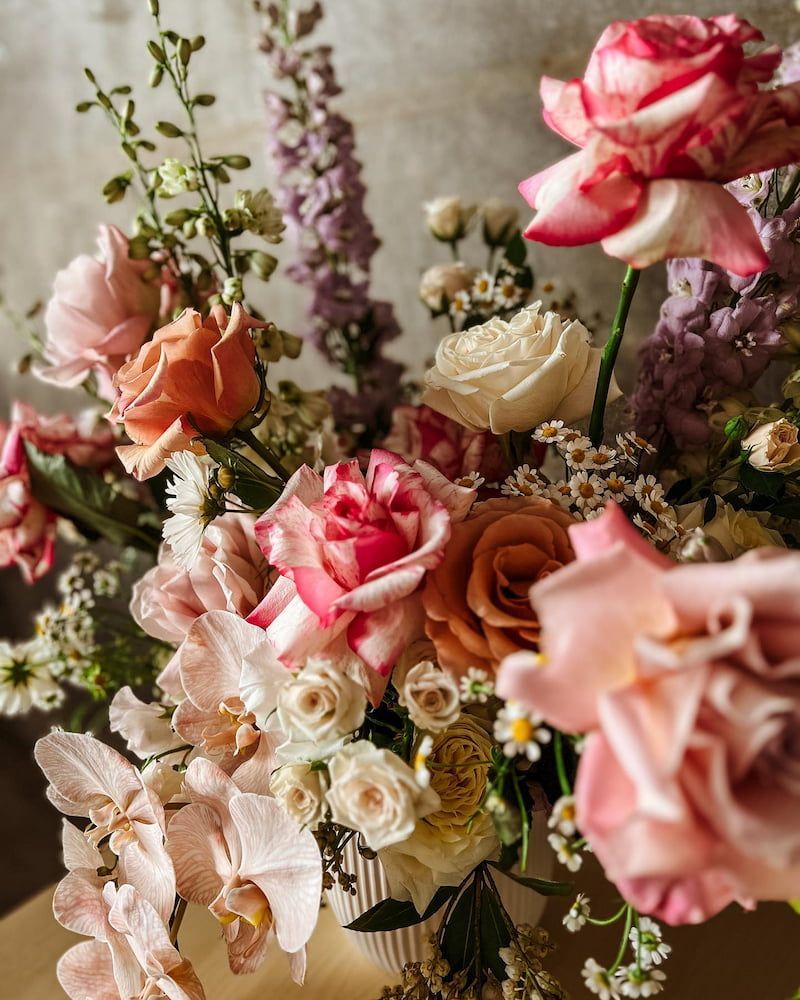 A Vase Filled With Pink and White Flowers is Sitting on a Table — Suncoast Flowers in Birtinya, QLD
