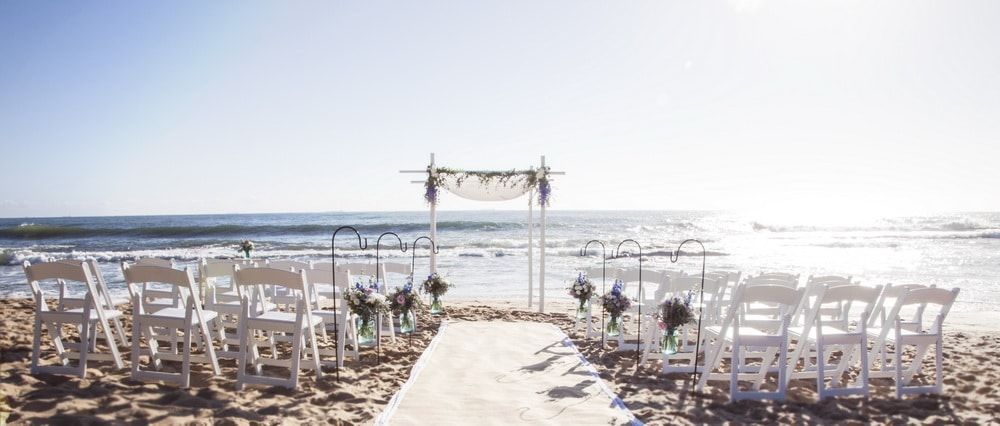 A Wedding Ceremony is Taking Place on the Beach — Suncoast Flowers in Birtinya, QLD
