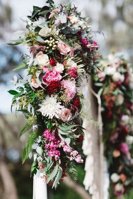 A Wedding Arch Decorated With Pink and White Flowers and Greenery — Suncoast Flowers in Birtinya, QLD