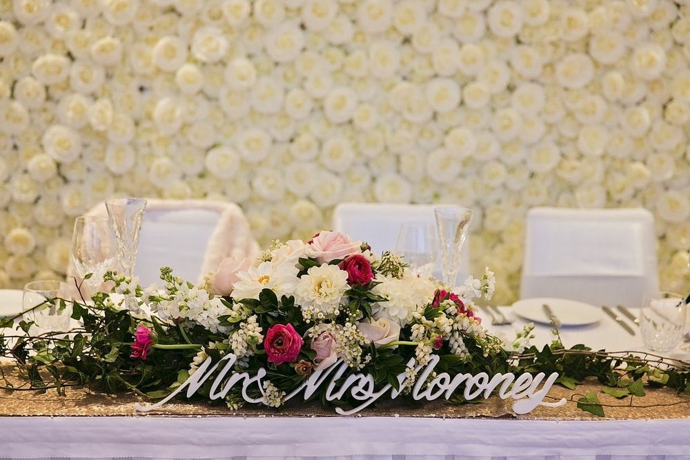 A Table With Flowers and a Sign — Suncoast Flowers in Birtinya, QLD