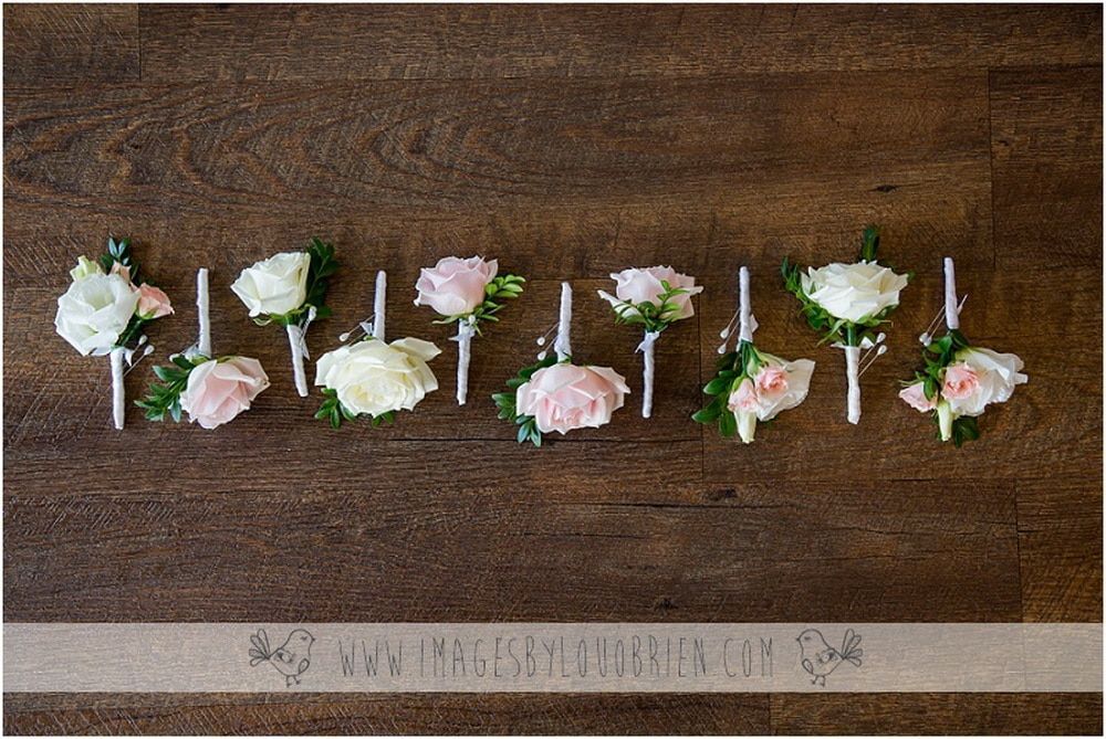 A Row of Pink and White Flowers on a Wooden Table — Suncoast Flowers in Birtinya, QLD