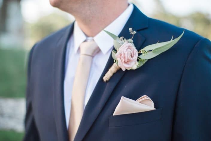 A Man in a Suit and Tie With a Flower in His Pocket — Suncoast Flowers in Birtinya, QLD