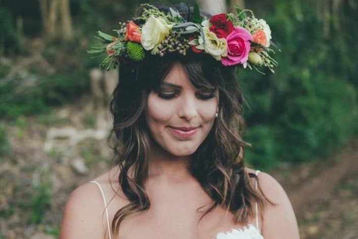 A Woman in a Wedding Dress is Wearing a Flower Crown on Her Head — Suncoast Flowers in Birtinya, QLD