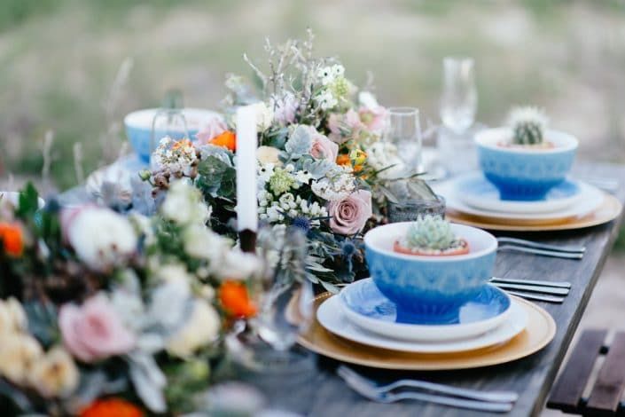 A Table With Plates, Bowls, Candles, and Flowers on It — Suncoast Flowers in Birtinya, QLD