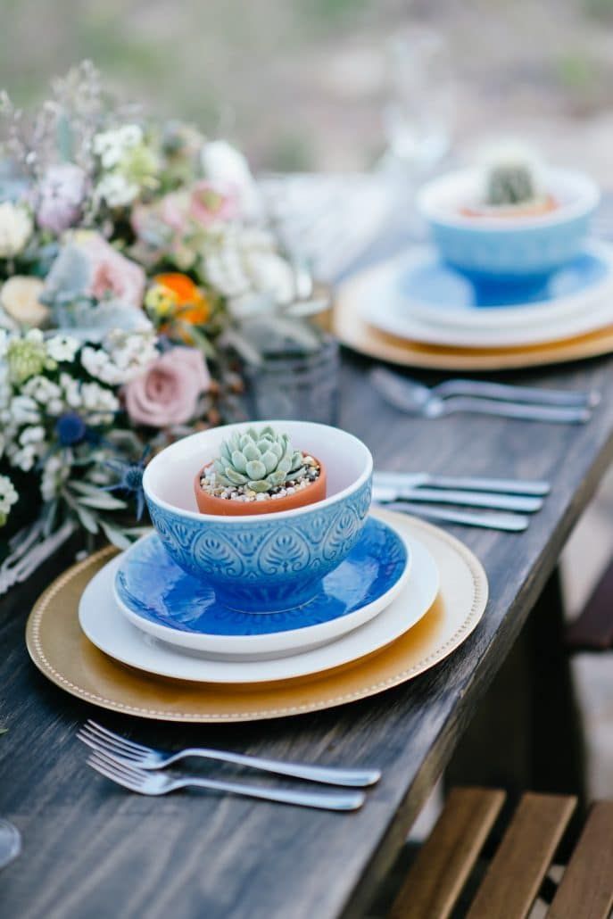 A Wooden Table With Plates  Bowls, and Silverware on It — Suncoast Flowers in Birtinya, QLD