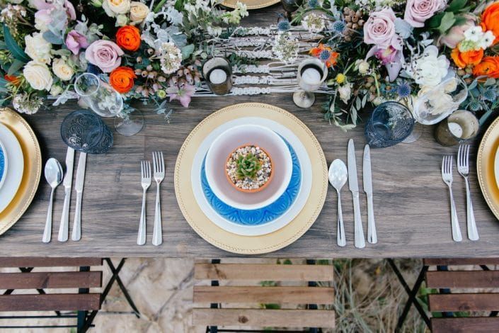 A Table With Plates, Bowls, Candles, and Flowers on It — Suncoast Flowers in Birtinya, QLD
