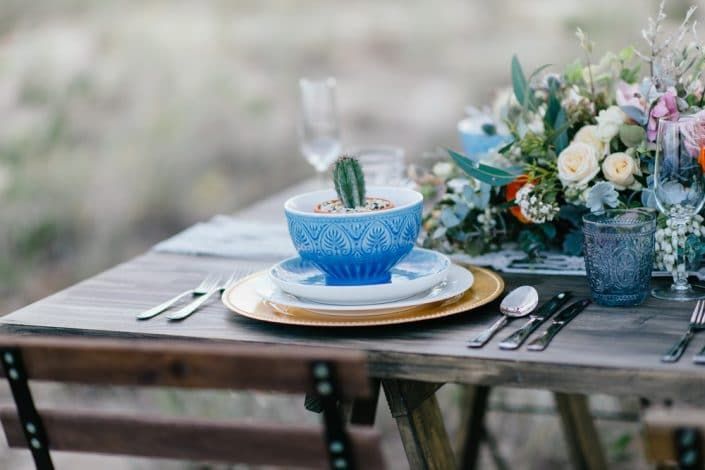A Table With Plates, Bowls, Candles, and Flowers on It — Suncoast Flowers in Birtinya, QLD