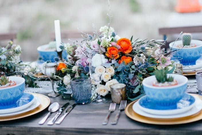 A Table With Plates, Bowls, Candles, and Flowers on It — Suncoast Flowers in Birtinya, QLD