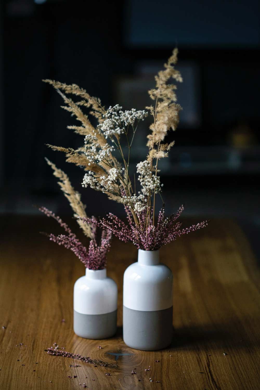 Two Vases Filled With Dried Flowers Are Sitting on a Wooden Table — Suncoast Flowers in Birtinya, QLD