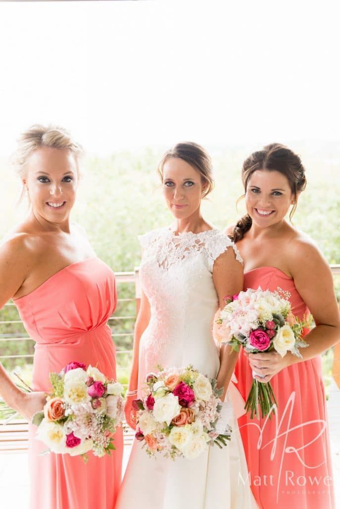 A Bride and Her Bridesmaids Are Posing for a Picture While Holding Bouquets of Flowers — Suncoast Flowers in Birtinya, QLD