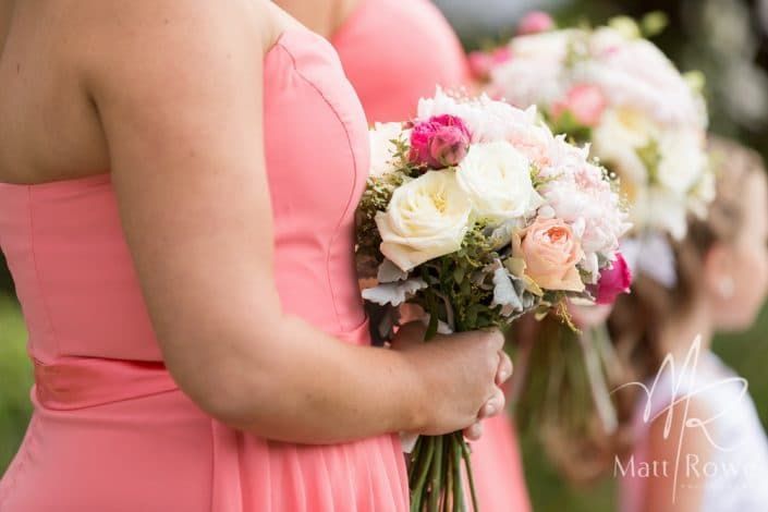 Two Bridesmaids in Pink Dresses Are Holding Bouquets of Flowers — Suncoast Flowers in Birtinya, QLD