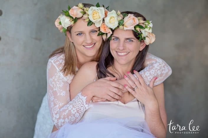 Two Women Wearing Flower Crowns Are Hugging Each Other — Suncoast Flowers in Birtinya, QLD