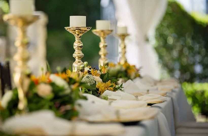 A Long Table With Candles and Flowers on It — Suncoast Flowers in Caloundra, QLD