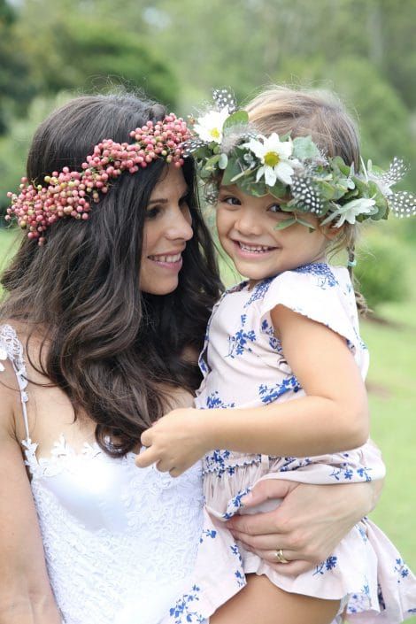 A Woman is Holding a Little Girl Wearing a Flower Crown — Suncoast Flowers in Birtinya, QLD