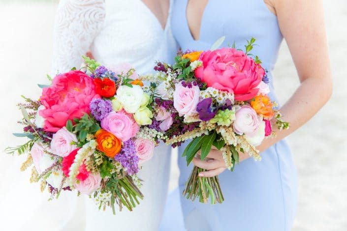 A Bride and Her Bridesmaids Are Holding Colorful Bouquets of Flowers — Suncoast Flowers in Birtinya, QLD
