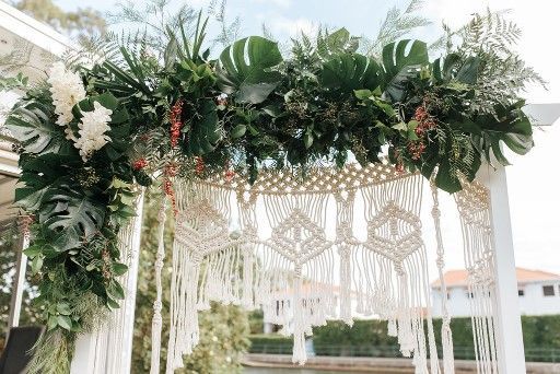 A White Arch Decorated With Greenery and Flowers — Suncoast Flowers in Birtinya, QLD
