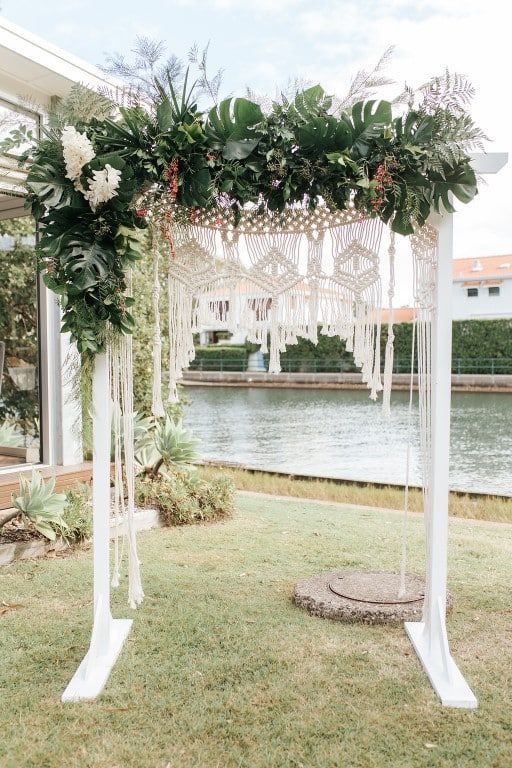 A White Arch Decorated With Greenery and Flowers — Suncoast Flowers in Birtinya, QLD