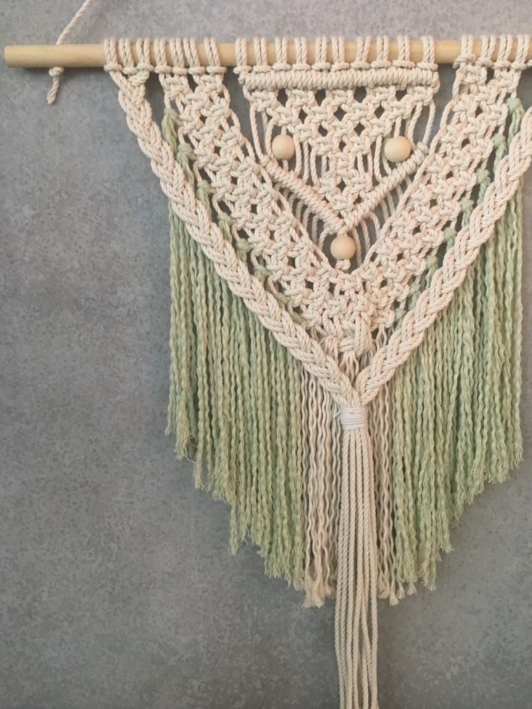 A Close Up of a Macrame Wall Hanging on a Wooden Stick — Suncoast Flowers in Birtinya, QLD