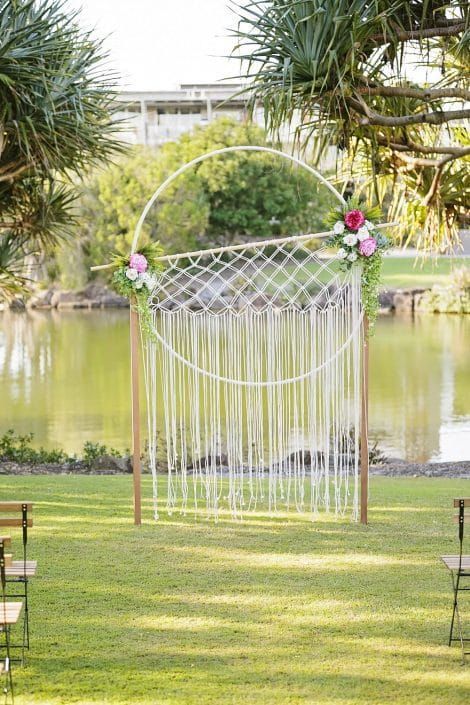 A Wedding Ceremony is Taking Place in Front of a Lake — Suncoast Flowers in Birtinya, QLD