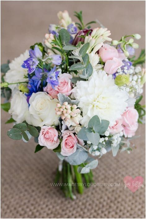 A Bouquet of Pink, White and Blue Flowers is Sitting on a Carpet — Suncoast Flowers in Birtinya, QLD