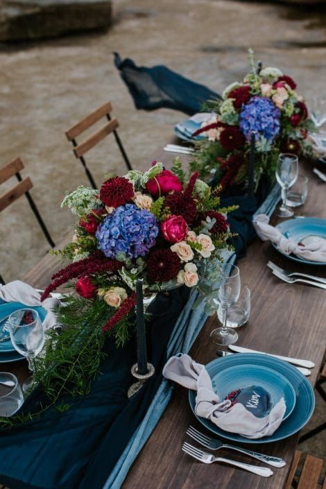 A Long Table With Plates, Utensils, and Flowers on It — Suncoast Flowers in Birtinya, QLD