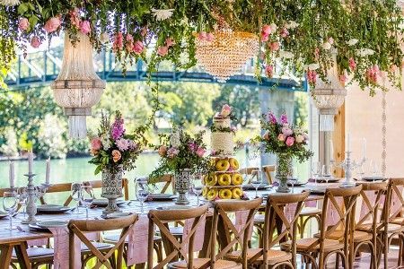 A Long Table With Chairs and Flowers Hanging From the Ceiling — Suncoast Flowers in Birtinya, QLD