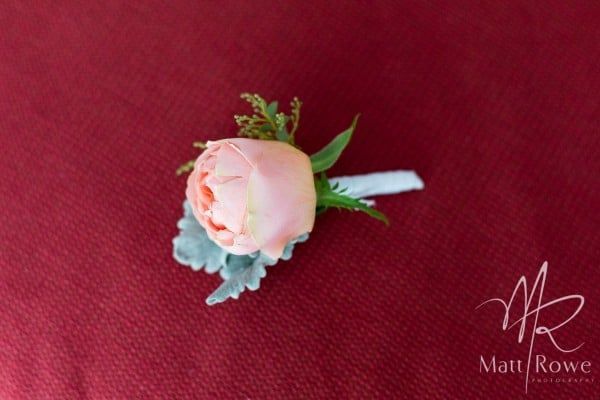 A Pink Flower is on a Red Cloth With Matt Rowe Written on It — Suncoast Flowers in Birtinya, QLD