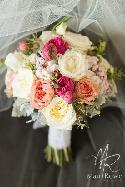 A Bouquet of Pink and White Flowers is Sitting Under a Veil — Suncoast Flowers in Birtinya, QLD