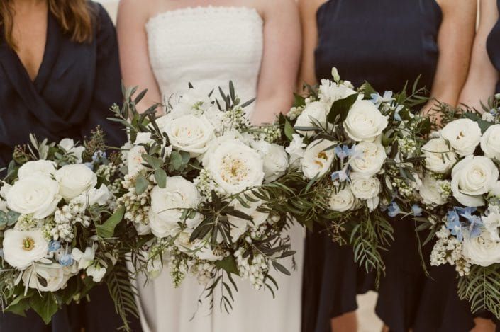 A Bride and Her Bridesmaids Are Holding Bouquets of White Flowers — Suncoast Flowers in Birtinya, QLD