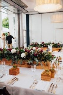 A Long Table With Flowers and Utensils on It — Suncoast Flowers in Birtinya, QLD