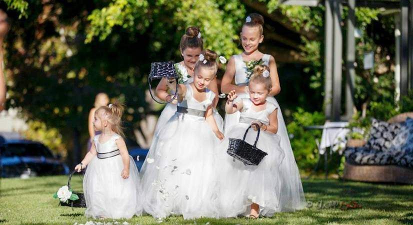 A Group of Flower Girls Are Walking Down the Aisle at a Wedding — Suncoast Flowers in Birtinya, QLD