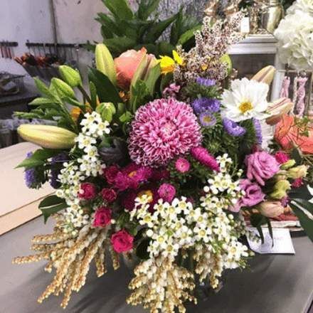 A Large Bouquet of Flowers is Sitting on a Table — Suncoast Flowers in Maroochydore, QLD