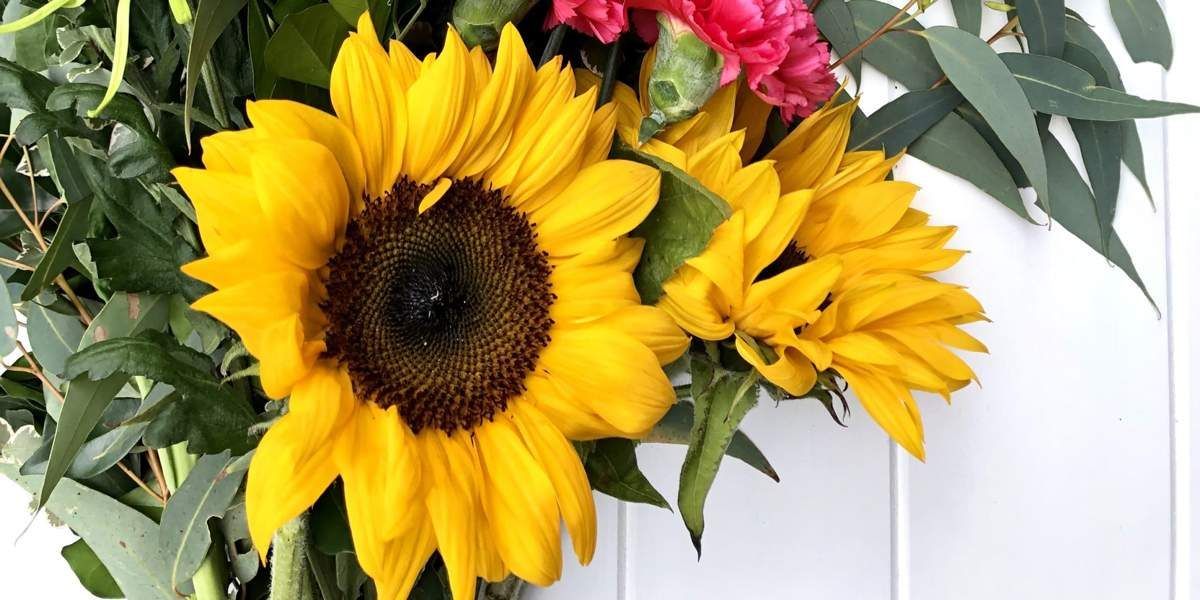 A Close Up of a Sunflower in a Vase With Other Flowers — Suncoast Flowers in Caloundra, QLD