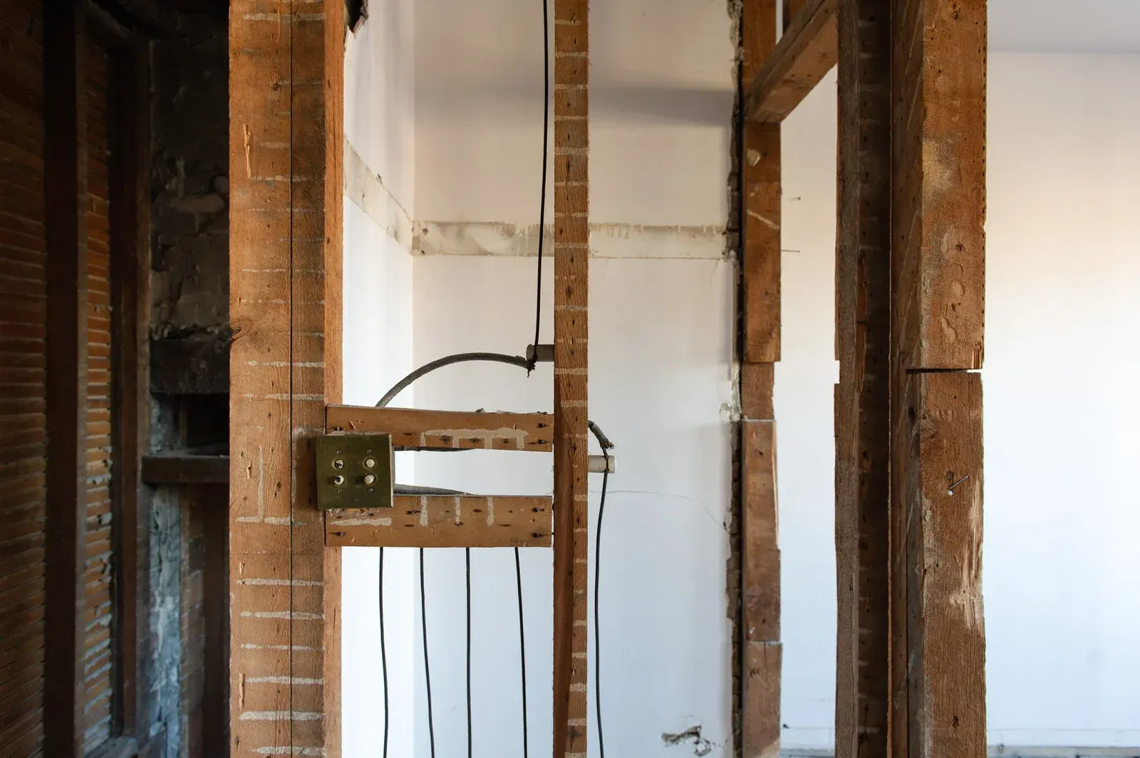 Indoor spa with blue water, surrounded by glass walls and a skylight roof.