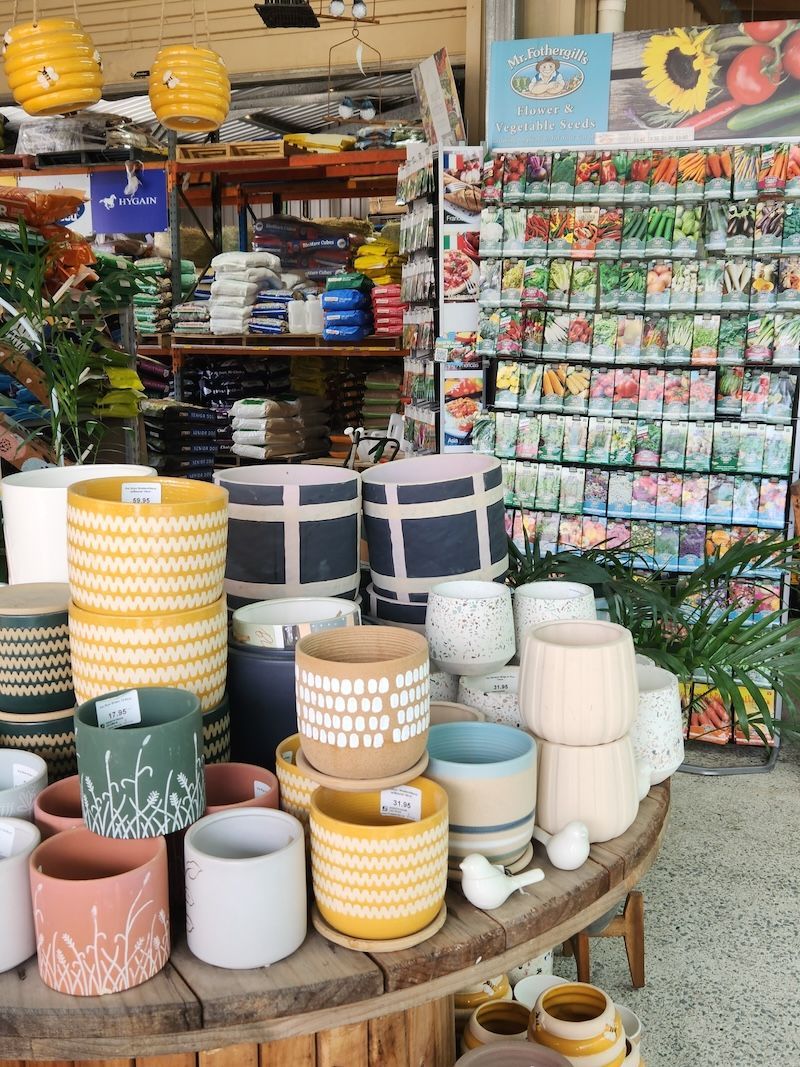 Warehouse filled with lots of Boxes and Shelves — Contact Dayboro Produce and Hardware in Dayboro, QLD