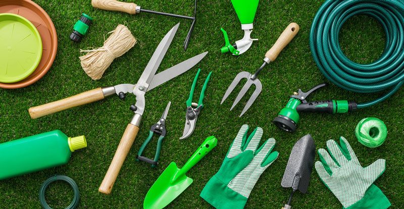 Bunch of Gardening Tools are Laying on the Grass — Gardening Supplies in Dayboro, QLD