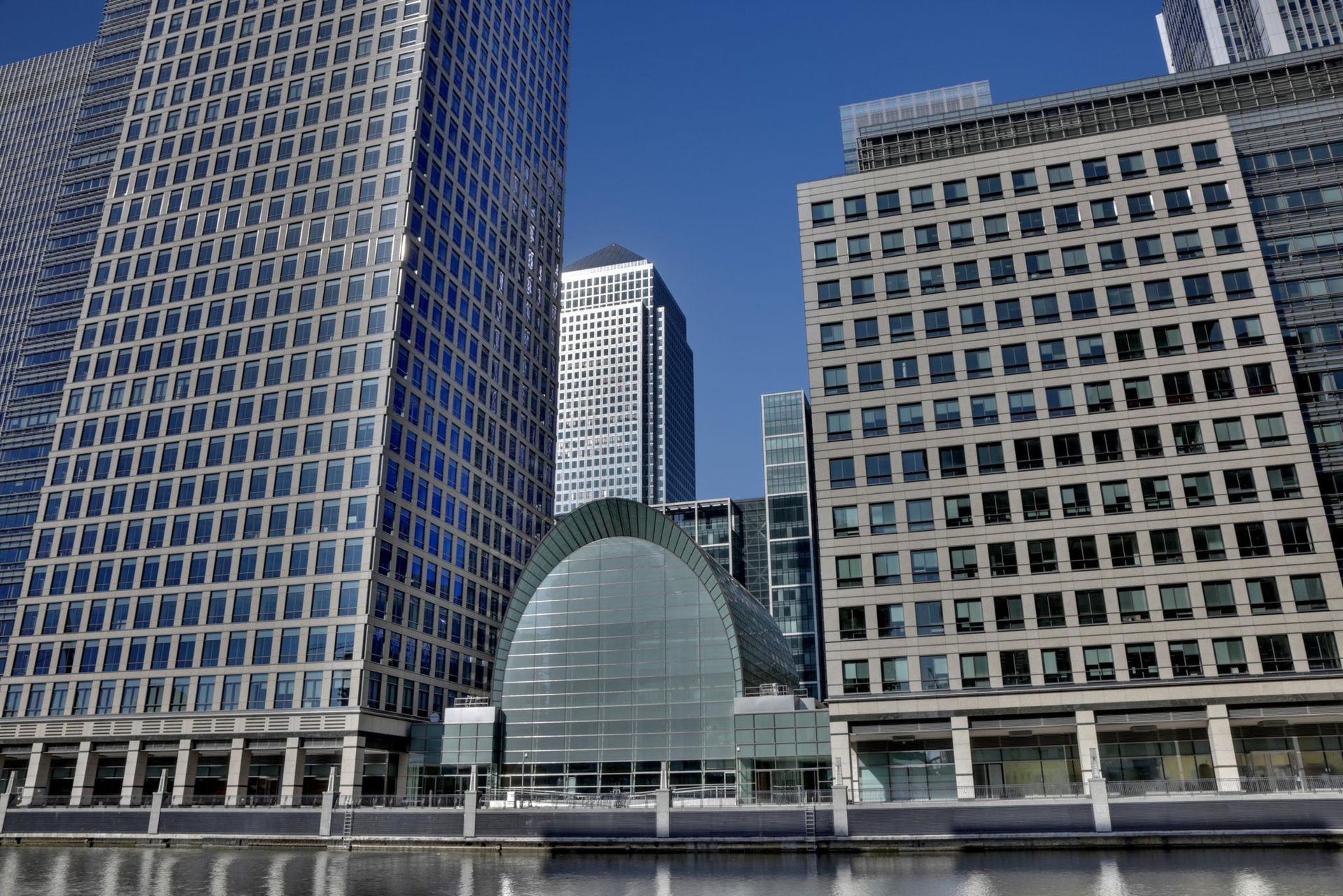 Office cleaners sanitising desks and meeting rooms in Tower Hamlets office