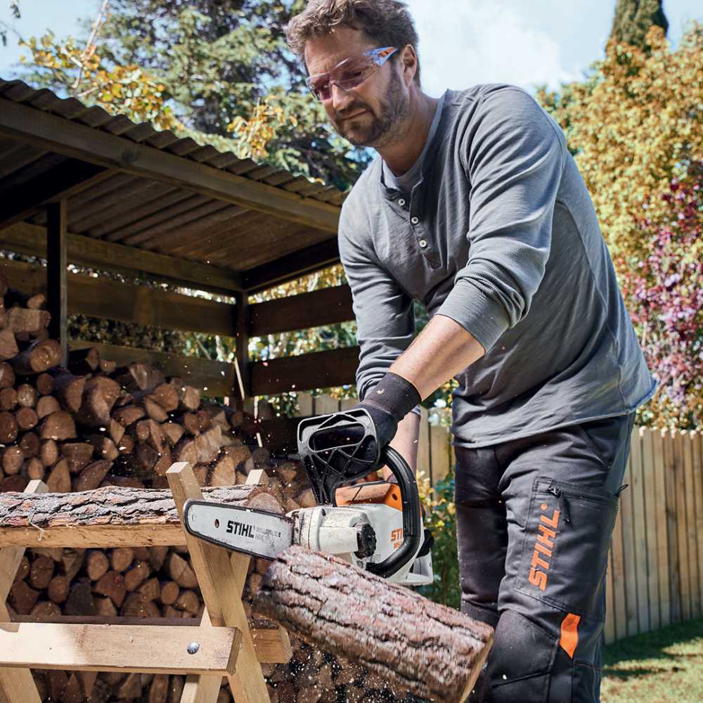 Man Cutting the Wood Tree — Stihl Shop Atherton & Atherton Motorcycles in Atherton, QLD
