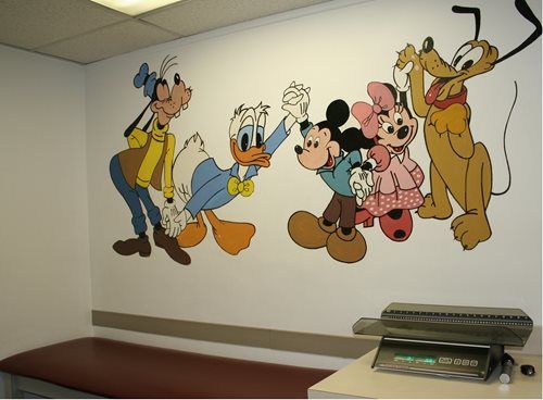 Mural of Disney characters on the wall of a pediatrician's office