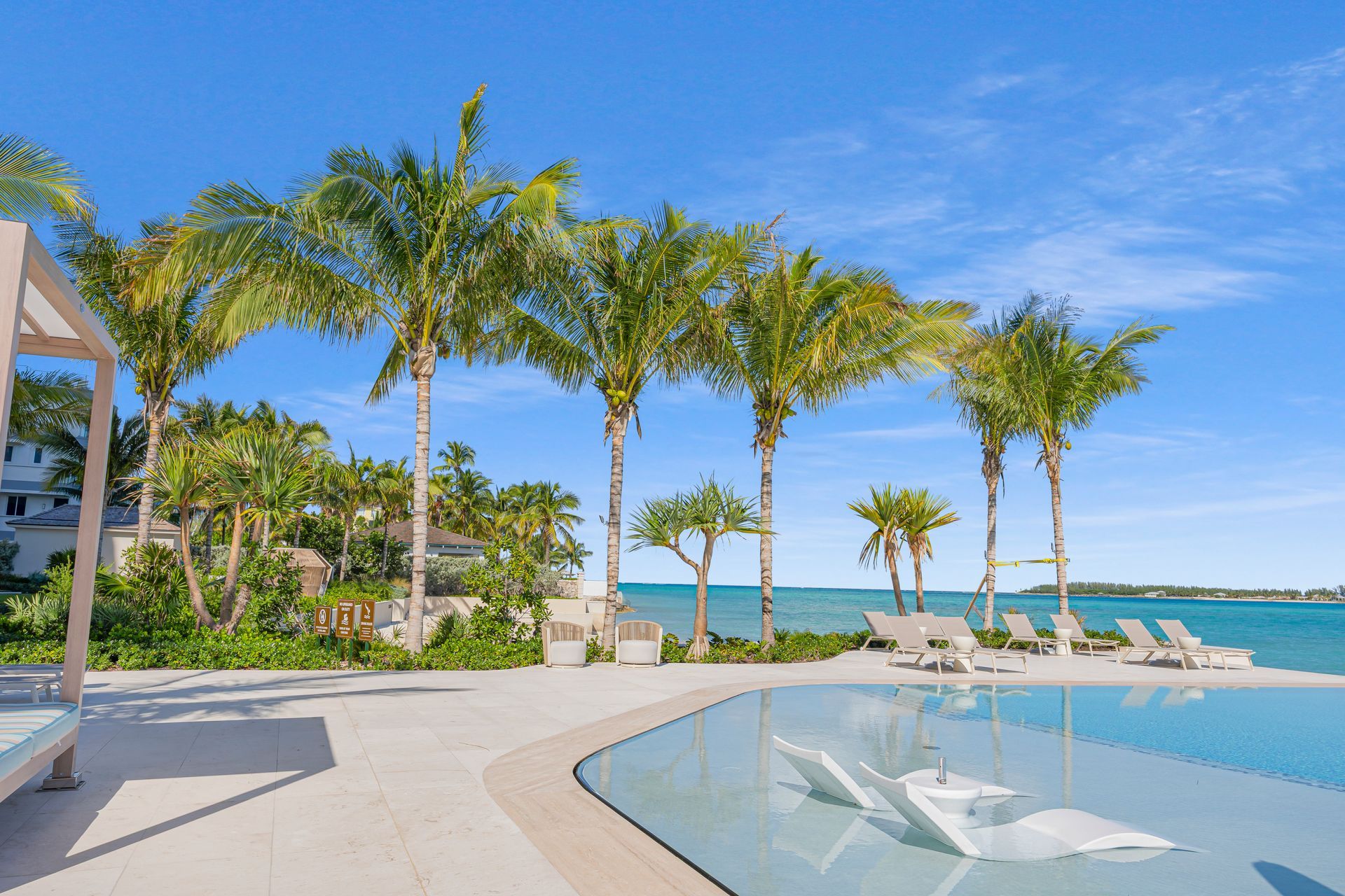 Infinity pool with beach view at Aqualina luxury beachfront property in Nassau, The Bahamas