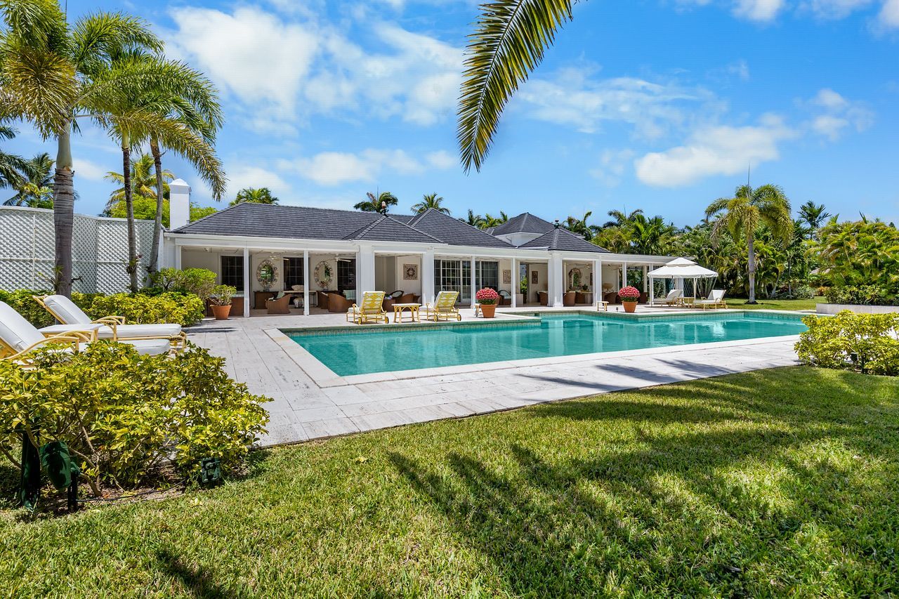 Beachfront facade of Aqualina with oceanview pool in Nassau, The Bahamas