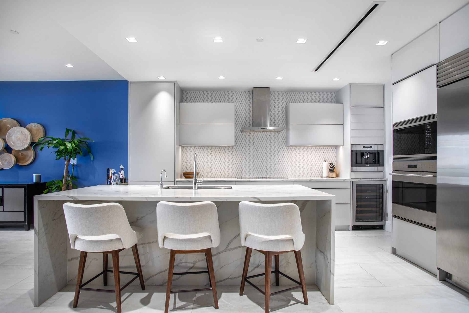 Open-concept kitchen and dining area in One Cable Beach luxury condo