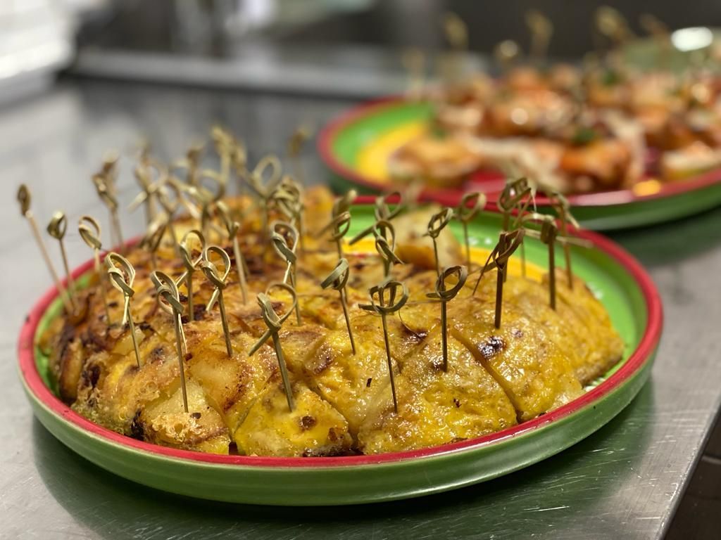 a close up of a plate of food with toothpicks on it on a table .